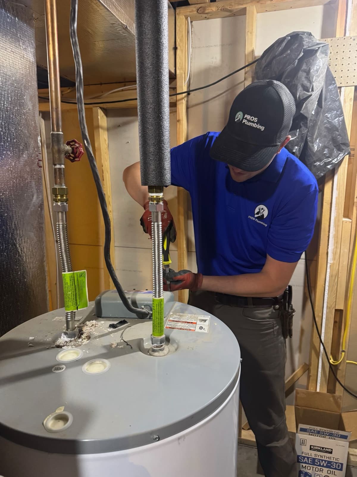 PROS Plumbing technician installing a water heater