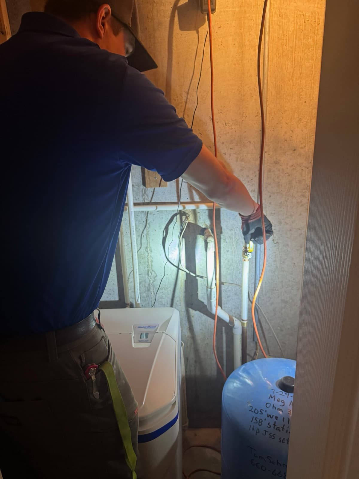 Servicing a well pressure tank and water softener